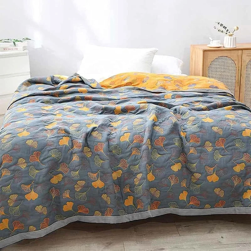 Cozy reversible blanket with nature leaf motif